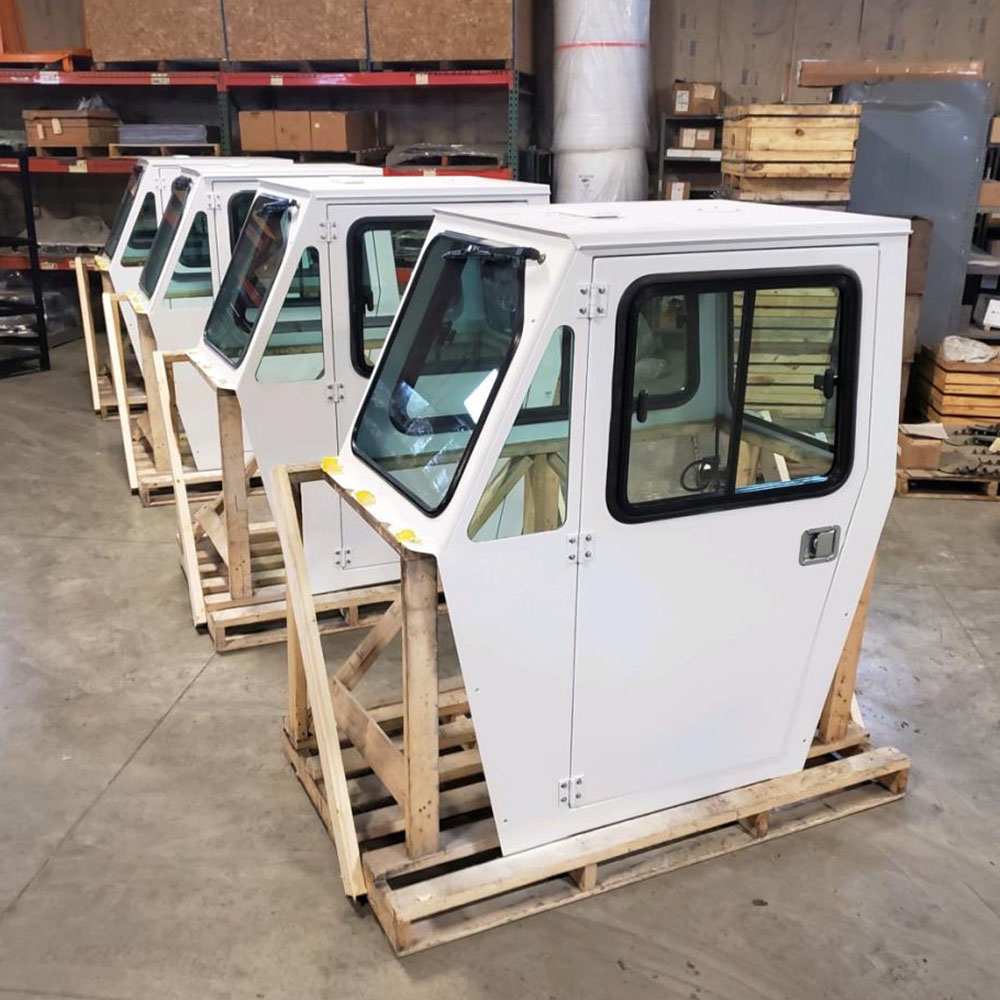 4 white operator cabs in warehouse